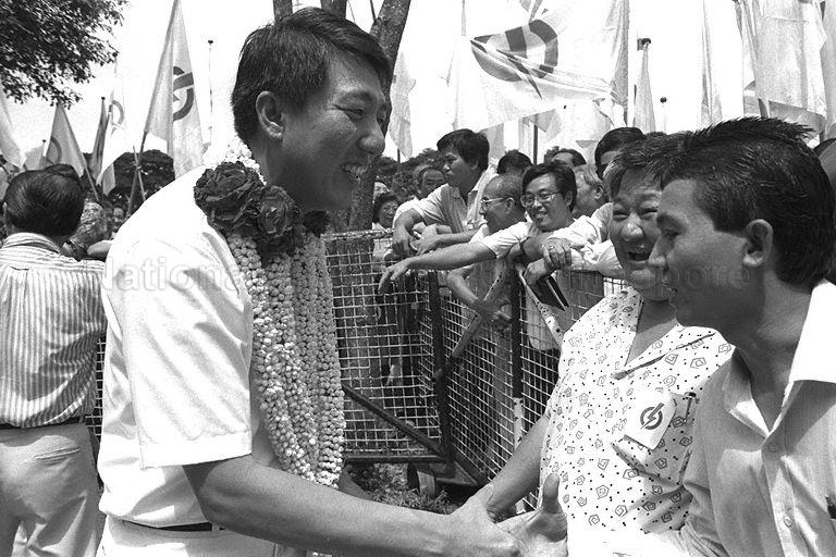 People's Action Party (PAP) candidate Commodore (Res) Teo Chee Hean shaking hands with supporters at Tao Nan School on nomination day for by-election in Marine Parade Group Representation Constituency (GRC)