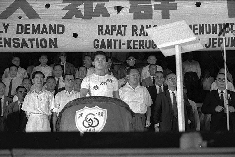 Prime Minister Lee Kuan Yew (third from right), Minister for Home Affairs and Acting Minister for Labour Ong Pang Boon (second from left) and Political Secretary to the Prime Minister Jek Yeun Thong attending mass rally at the Padang organised by Chinese Chamber of Commerce to press for reasonable settlement of a Japanese atonement gesture for wartime atrocities