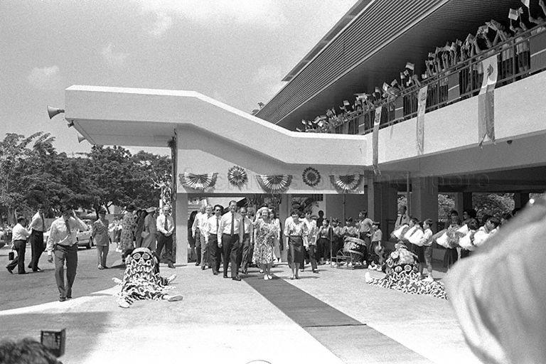 Queen Elizabeth II is escorted on the red carpet by Minister for Education and Minister-in-Attendance Dr Tony Tan and Senior Minister of State for Education Dr Tay Eng Soon upon arrival at Townsville Primary School in Ang Mo Kio.  The Queen is here on a thre-day state visit at the invitation of President and Mrs Wee Kim Wee.