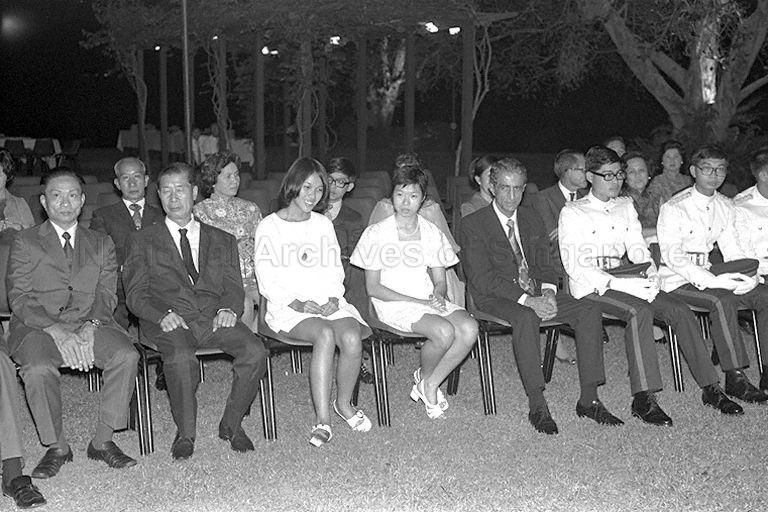 President's Scholars Lim Teik Hock (St Andrew's), Lim Hng Kiang (Raffles Institution), Lee Wei Ling (Raffles Institution) and Lee Bee Wah (National Junior College) seated with family members of three other Scholars, who are overseas, at award presentation ceremony held at Istana