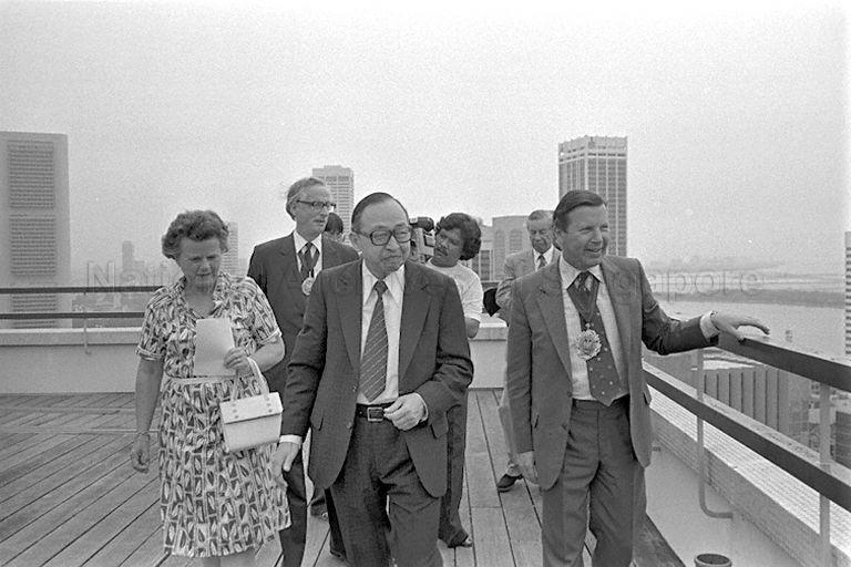 Minister for National Development Teh Cheang Wan (centre) showing the view from the top of Ministry of National Development Building to visiting Lord Mayor of London Sir Christopher Leaver (right) and delegation