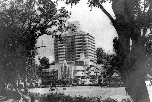 The Cathay Building at Handy Road. Completed in 1939, it was the first skyscraper in Singapore, housing luxury flats and Singapore's first air-conditioned cinema. At beginning of WWII, the main building was rented out to the government and British Malaya Broadcasting Corporation, becoming the "brain centre" for the government. During Japanese Occupation, it was used to house the Japanese Broadcasting Department, Military Propaganda Department and Military Information Bureau. The (new) Alhambra at Beach Road was the first air-conditioned cinema hall in Singapore and not as commonly believed, the Cathay.