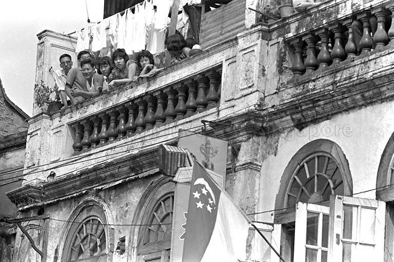 National Day Parade 1966 at the Padang - Proud Singaporeans in Chinatown watching the parading contingents from their balcony