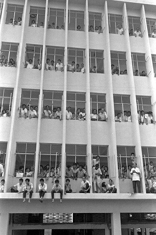 National Day Parade 1966 at the Padang - Spectators filling up a multi-storey building in Chinatown to view parade