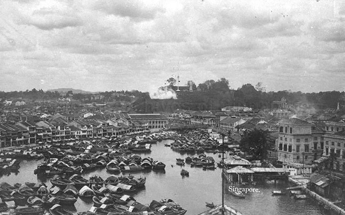 View of Boat Quay looking towards Fort Canning Hill. The covered landing stage on the right was the site of the original Hallpike Boatyard where boat building and repairs were carried out from 1823 to late 1860s.