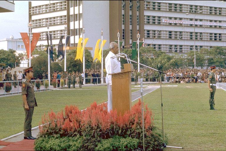 National Day Parade 1977 at Toa Payoh Stadium -- Minister for Foreign Affairs S Rajaratnam reviewing marchpast