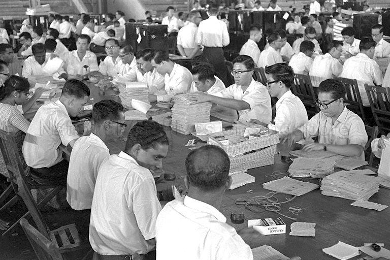 Counting of ballot papers of the Singapore National Referendum 1962 at Singapore Badminton Stadium counting centre