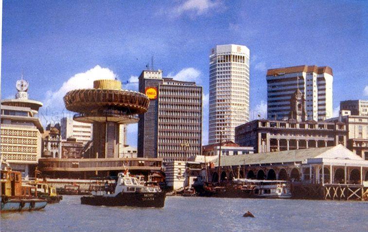 View of Singapore's Central Business District waterfront with Change Alley Aerial Plaza (second from left), Shell House, United Overseas Bank (UOB) building (now known as UOB Plaza Two), Maritime House and Clifford Pier (right foreground).