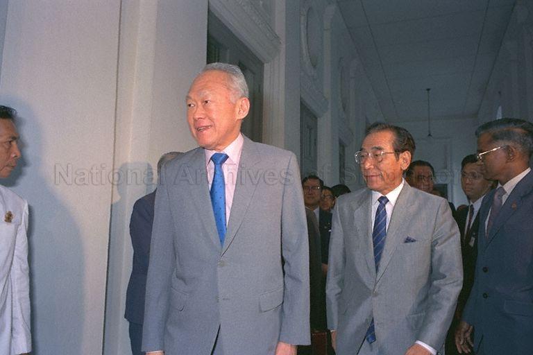 Prime Minister Lee Kuan Yew and Japan's Ambassador to Singapore Wasuke Miyake (Mr Lee's left) sending off Japanese Prime Minister Noboru Takeshita (not in picture) who is leaving for Changi Airport. At right is Director of Protocol and Consular Division, Ministry of Foreign Affairs V K Rajan.