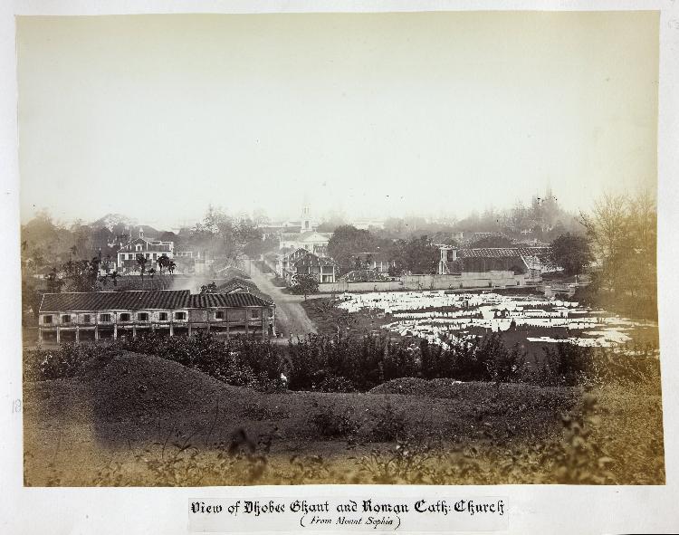 View of Dhoby Ghaut from Mount Sophia. Drying laundry can be seen in the field to the right of the middle foreground. Picture from nas.gov.sg