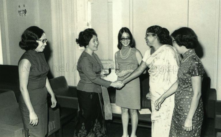 Puan Noor Aishah receiving the "Laurel Leaf" award, the highest award of the Singapore Girl Guides' Association, at the Istana