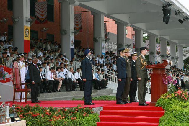 Chief of Defence Force Lieutenant General Desmond Kuek leading Singapore Armed Forces (SAF) personnel in reciting the SAF pledge to reaffirm their loyalty to the nation and their commitment to the defence of Singapore during SAF Day parade at SAFTI Military Institute. On the left is President S R Nathan.