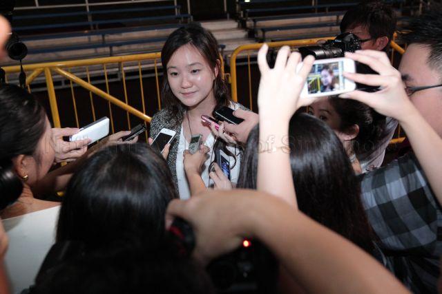 Nicole Seah, counting agent for presidential candidate Tan Jee Say, being interviewed by the media at Bedok Stadium during the wait for presidential election result