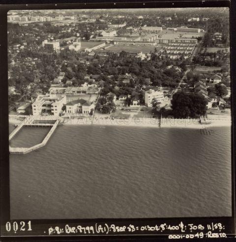 Aerial view of Joo Chiat with Chinese Swimming Club visible, identifiable by its enclosed swimming pool jutting out into the sea