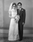 Full length portrait of bride and groom