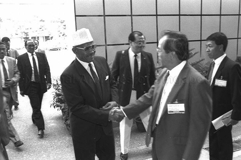 Prime Minister of Djibouti Barkat Gourad Hamadou being greeted upon arrival at World Trade Centre Hall 5 to attend "Singaport '90" exhibition