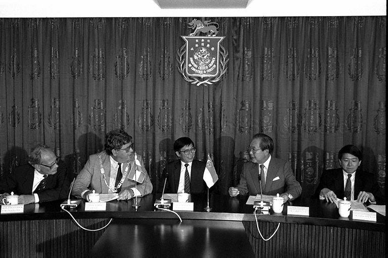 President of Singapore Chinese Chamber of Commerce and Industry (SCCCI) Tan Eng Joo (second from right), Minister of State for Communications and Information and Trade and Industry Mah Bow Tan (centre) and Mayor of Rotterdam Dr A Peper (second from left) at SCCCI to attend signing ceremony of 99-year land lease of Singapore Trade and Distribution Centre in Rotterdam
