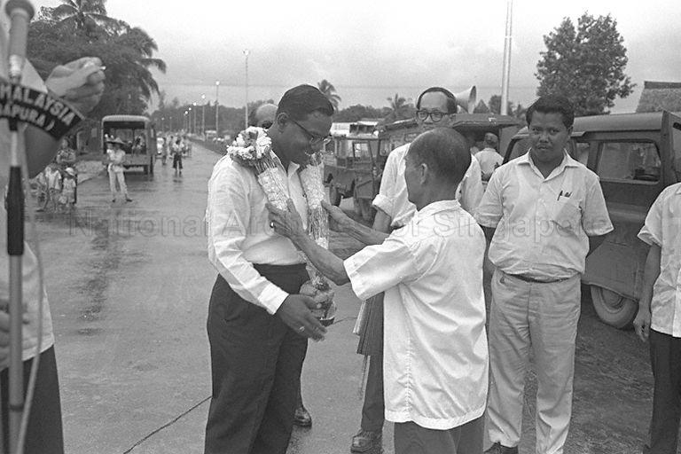 Legislative Assemblyman for Aljunied S V Lingam being garlanded when he arrives to officiate at opening of Braddell Road Bridge