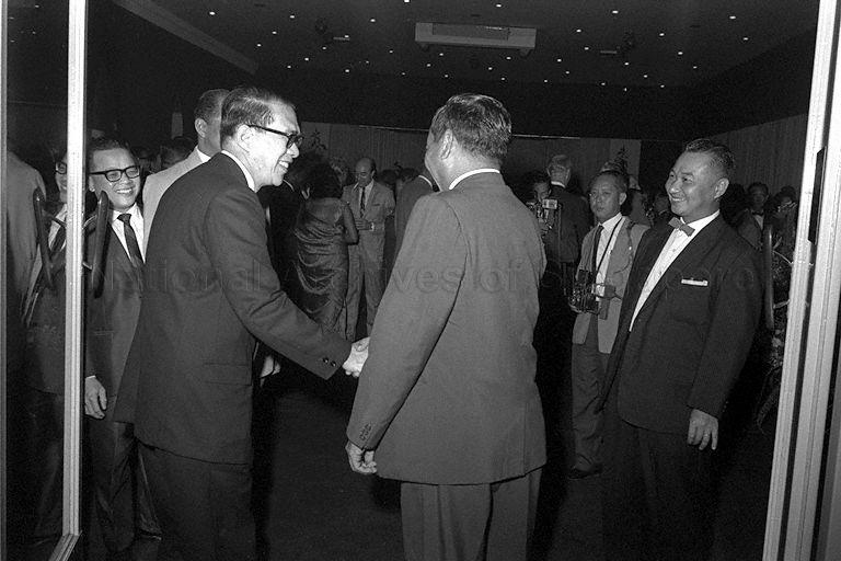 Chairman of Economic Development Board (EDB) Hon Sui Sen welcoming Minister of Finance Dr Goh Keng Swee (back to camera) during cocktail party to mark EDB's third anniversary at Arundel Room in Goodwood Park Hotel