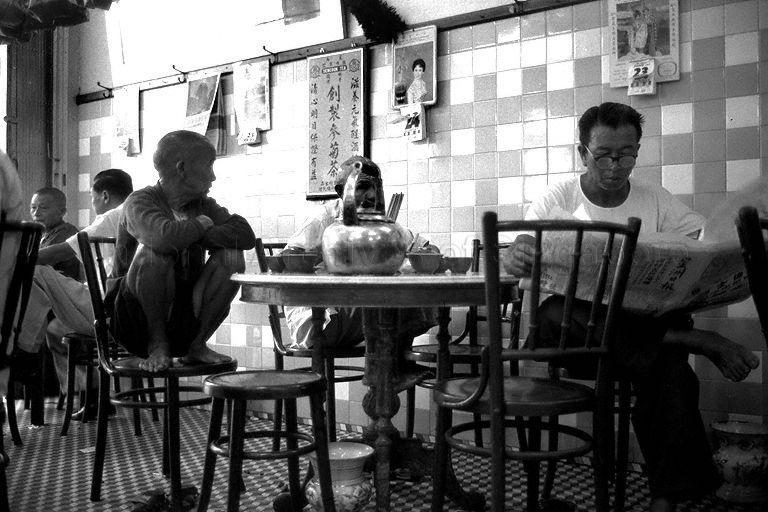 Customers enjoying Chinese tea at a traditional coffee shop