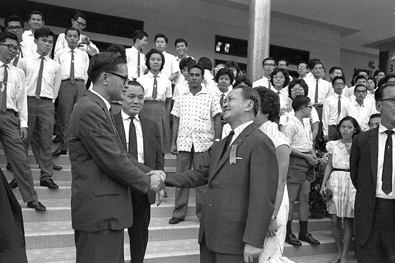 Minister for Education Yong Nyuk Lin being welcomed when he arrives to officiate inauguration ceremony of Ngee Ann College at Teochew Building, Tank Road. Looking on is Parliamentary Secretary to Ministry of Education Lee Khoon Choy (centre).