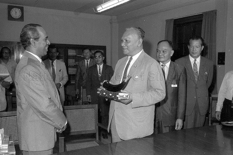 Minister for Culture S Rajaratnam (left) after presenting gift to Thailand's Minister for Education M L Pin Malakul when the latter who is leading the Thai delegation to the South-East Asia Cultural Festival calls on Minister for Culture.