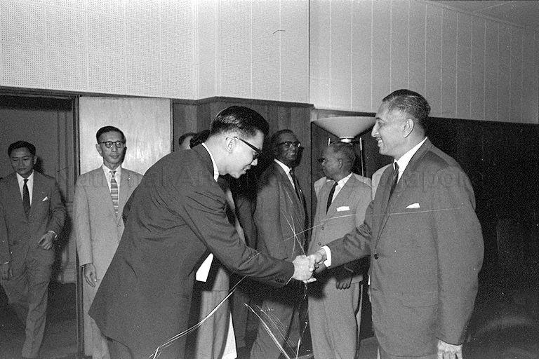 Member of the Commission of Inquiry on Education greeting Yang Di-Pertuan Negara Yusof Ishak when the Commission arrives to hand over the education report