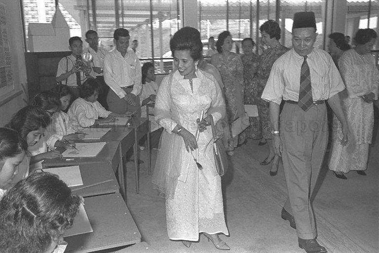 Raja Permaisuri Agong Tengku Budriah accompanied by principal of Sang Nila Utama Malay Secondary School Ismail bin Abdul Aziz (right) touring the school during her visit to the school while on state visit to Singapore
