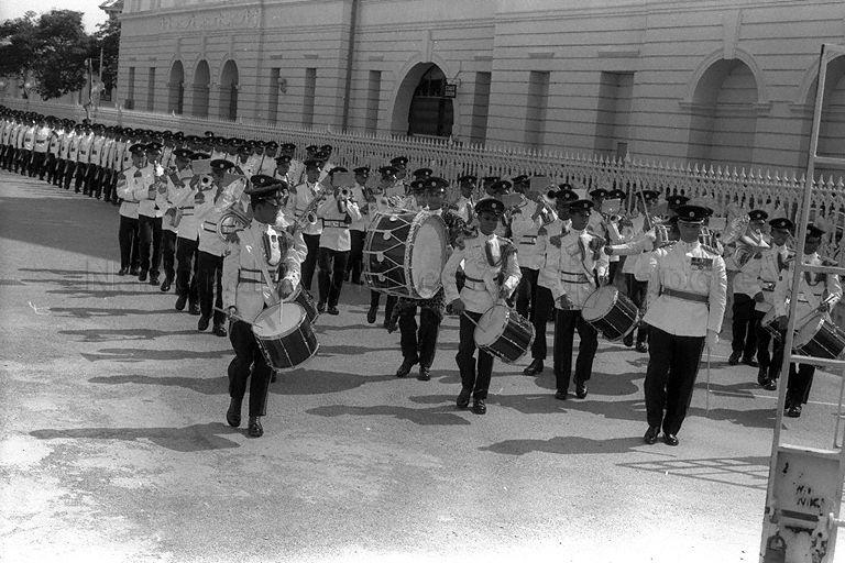 Guard of honour and band marching in front of Assembly House