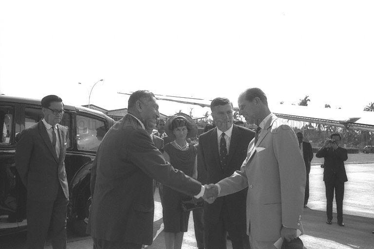 Duke of Edinburgh Prince Philip being welcomed by Yang Di-Pertuan Negara Yusof Ishak upon his arrival in Singapore. Looking on is Deputy British High Commissioner in Singapore Philip Moore.
