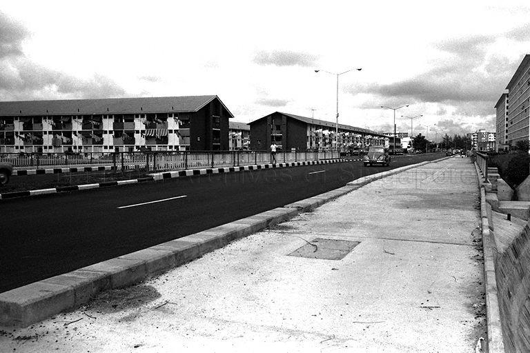Old Airport Road with flats at Dakota Crescent on the left