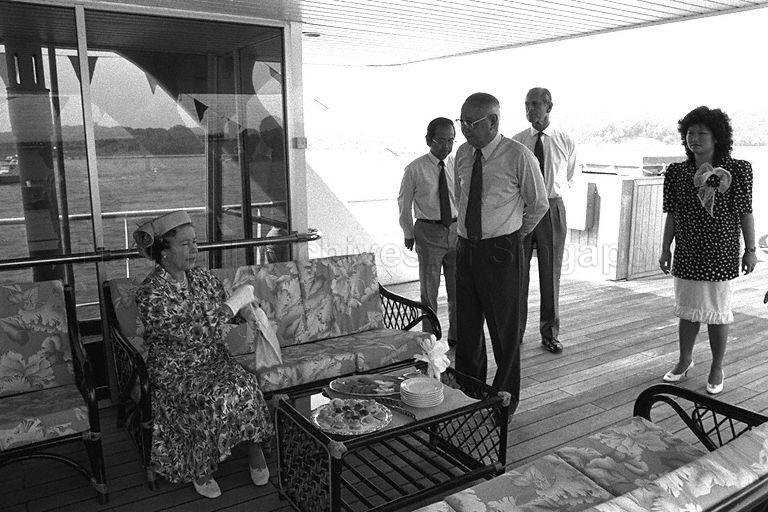 Queen Elizabeth II and the Duke of Edinburgh Prince Philip (second from right) with Chairman of Port of Singapore Authority (PSA) Lim Kim San and Executive Director Ng Kiat Chong during a tour of the Singapore Waterfront on board Harbour Queen, a PSA vessel. &nbsp;The Queen is here on a three-day state visit at the invitation of President and Mrs Wee Kim Wee.