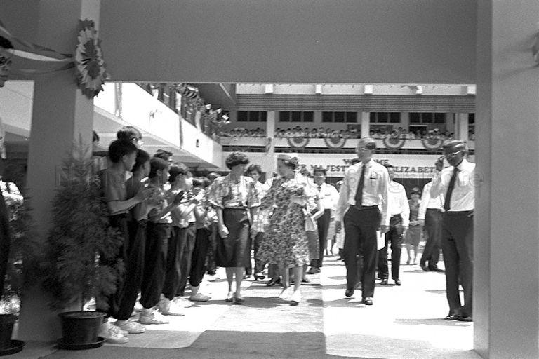 Queen Elizabeth II taking a tour of Townsville Primary School, accompanied by officials including Minister for Education and Minister-in-Attendance Dr Tony Tan and his wife and Senior Minister of State for Education Dr Tay Eng Soon. &nbsp;The Queen is here on a three-day state visit at the invitation of President and Mrs Wee Kim Wee.