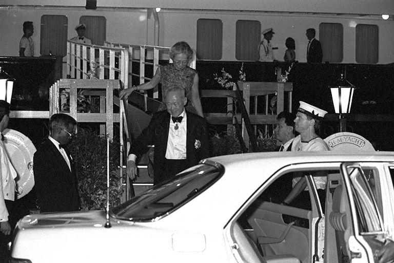 Prime Minister Lee Kuan Yew and his wife, Kwa Geok Choo disembarking the British royal yacht, HMY Britannia following the return banquet hosted by Queen Elizabeth II on the last day of the three-day state visit at the invitation of President and Mrs Wee Kim Wee.  On the left is Chief of Protocol, V K Rajan.