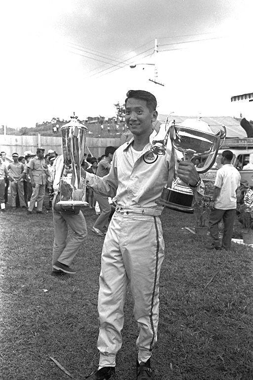 Albert Poon from Hong Kong, winner of the fourth Malaysia Grand Prix (also known as Malaysian Grand Prix) and the Saloons and Tourers race, with his trophies