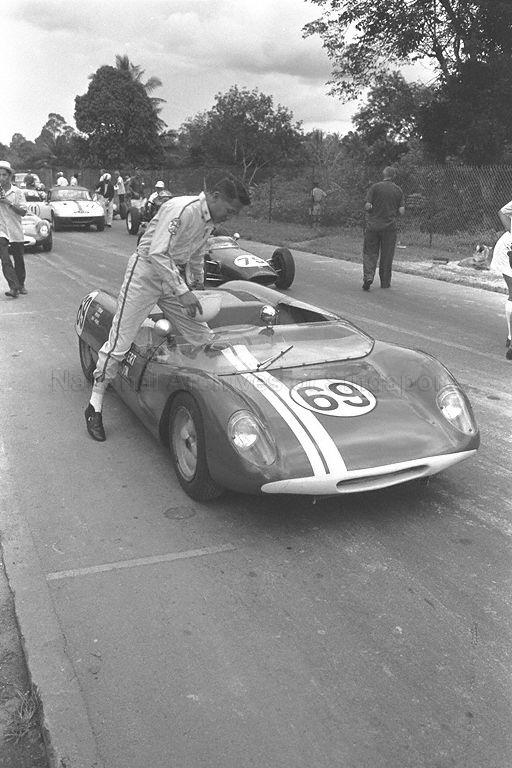 Albert Poon mounts his new-look number 69 Lotus 23, now sporting a "B" specification twin-cam engine. This particular car has been subject of a great deal of controversy and research over its early history. The car had already won at Johore (1963) and Singapore (1963). Singaporean Chong Boon Seng would assume ownership and run it from 1967 onwards. In the background of this photo is Mike Cook, in the ex-Chan Lye Choon's Lotus 20B single-seater; Barry Swann's Era R2A barely visible behind the Lotus 20B; Chong Boon Seng's Lotus Elan behind the Era and Lee Han Seng's Lotus 23B to the right of Era. While the apotheosis of the vintage racing car was reached in the years 1957 and 1958 when Vanwall presented itself as the last front-engined car capable of dominating a grand prix season, the Lotus 23 would reach its zenith at the Singapore Grand Prix of 1965 before the rear engine single-seater displaced everything before it.