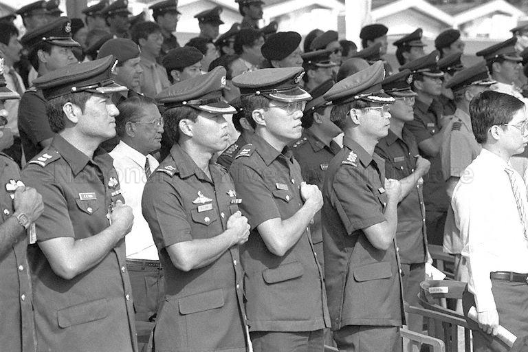 Singapore Armed Forces (SAF) officers taking the SAF pledge during military parade to mark SAF Day at Paya Lebar Airport. President Wee Kim Wee was present to review the parade.