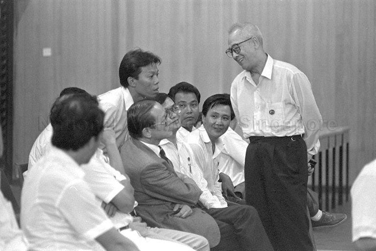 General Election 1988 - Workers' Party (WP) candidates for Eunos Group Representation Constituency (GRC) - Francis Seow (seated, in jacket suit), Mohd Khalit Baboo (bending over from back) and Dr Lee Siew Choh (standing) at East View Secondary School on nomination day for the General Election on 3 September 1988