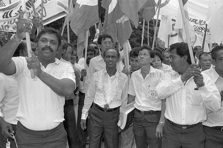 Singapore Democratic Party (SDP) candidate for Punggol constituency Abdul Rasheed s/o Y Abdul Kuthus (centre) and supporters at Geylang Methodist Secondary School on nomination day for the General Election on 3 September 1988