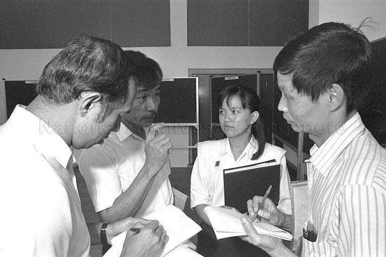 General Election 1988 - Singapore Democratic Party (SDP) candidate for Yuhua Ms Toh Kim Kiat and party member (second from left) with reporters at Jurong Junior College, the nomination centre for Hong Kah Group Representation Constituency (GRC) and single member constituencies of Ayer Rajah, Boon Lay, Jurong and Yuhua, on nomination day