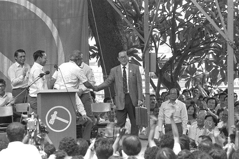 Workers' Party's (WP) Secretary-General J B Jeyaretnam (left) greeting Francis Seow (right) at the lunch-time rally held at Fullerton Square. Mr Seow is contesting in the Eunos Group Representation Constituency (GRC).
