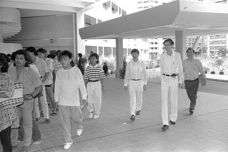 General Election 1988 - People's Action Party (PAP) candidate for Nee Soon South constituency Dr Koh Lip Lin (second from right) arriving at polling station
