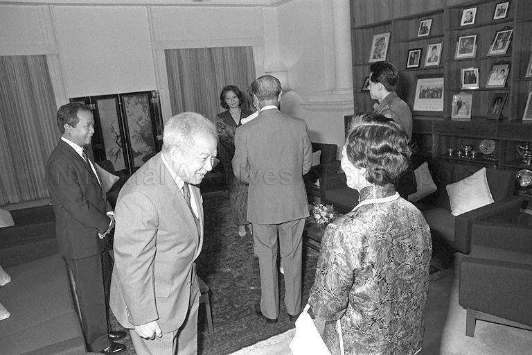 Cambodian Prince Norodom Sihanouk and his wife Princess Monique greeting First Lady Mrs Wee Kim Wee and President Wee respectively on their arrival at Istana. Looking on are their son Prince Ranariddh (left) and his wife Princess Marie (centre, far back).