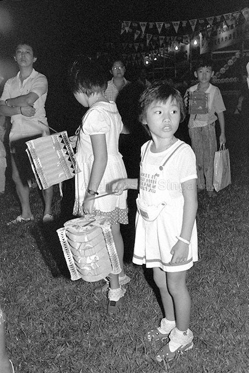 Children carrying lighted lanterns at Townsville Primary School to form lantern processions to herald the start of the traditional mid-autumn festival of mooncakes