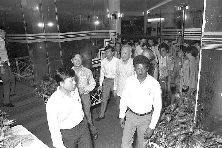 Prime Minister Lee Kuan Yew and Mrs Lee arriving for dinner at restaurant in NTUC Pasir Ris Resort. Third from left is the resort's chairman Alan Choe.