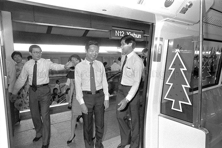 Chairman of Singapore Mass Rapid Transit (SMRT) Fock Siew Wah (left) and Minister for Communications and Information and Second Minister for Defence (Policy) Dr Yeo Ning Hong (centre) boarding the train at Yishun station for the inaugural ride to Ang Mo Kio and back after the official opening of Section 5 of the MRT system that adds two new stations on the northern line - Khatib and Yishun.
