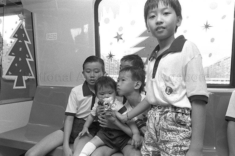 Five of some 50 children from the Children's Aid Society and the Children's Society's Convalescent Home in the inaugural ride to Yishun