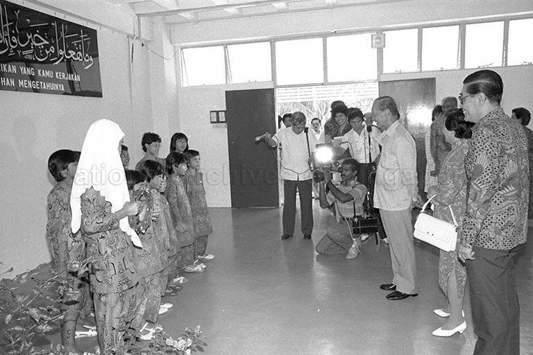Girls at Darul Ihsan Lilbanat orphanage greeting President Wee Kim Wee and the First Lady with sunny smiles and a Malay song