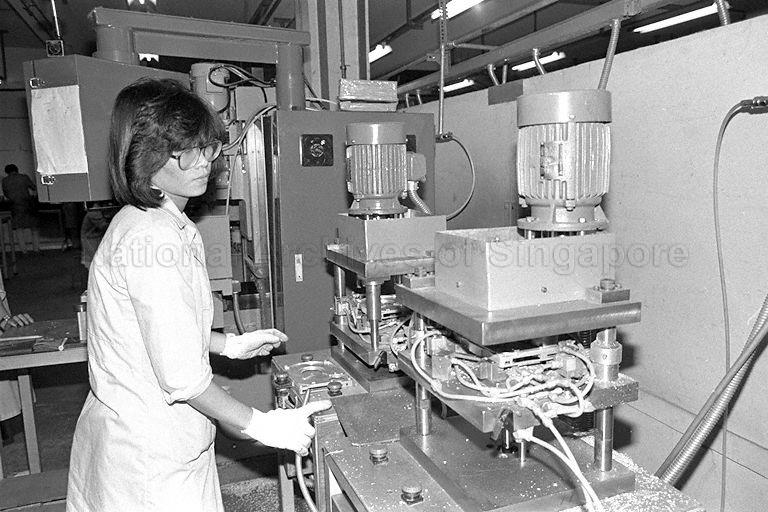 An employee of Uraco Precision Engineering operating a machine at the Chai Chee plant
