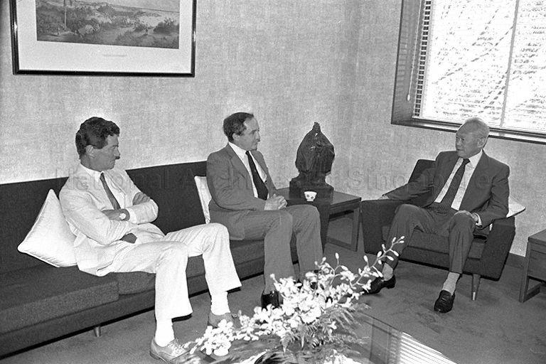 Britain's Secretary of State for Defence George Younger (centre) and his official (left) calling on Prime Minister Lee Kuan Yew at Istana